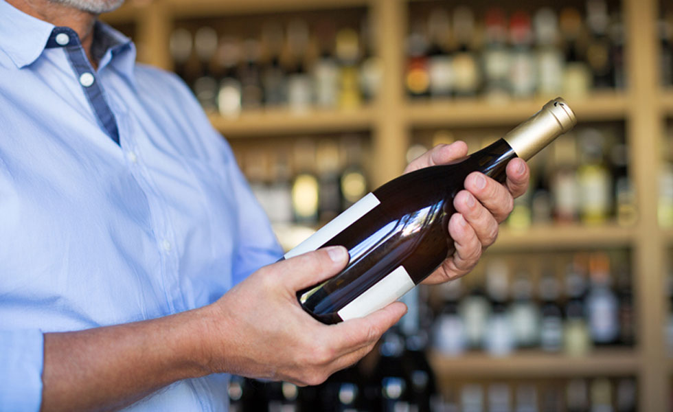 man holding a wine bottle